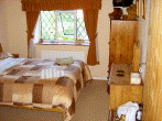Guest room with king-sized bed and en-suite bathroom