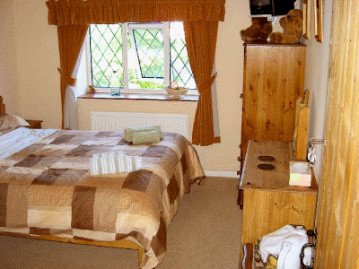 Guest room with king-sized bed and en-suite bathroom